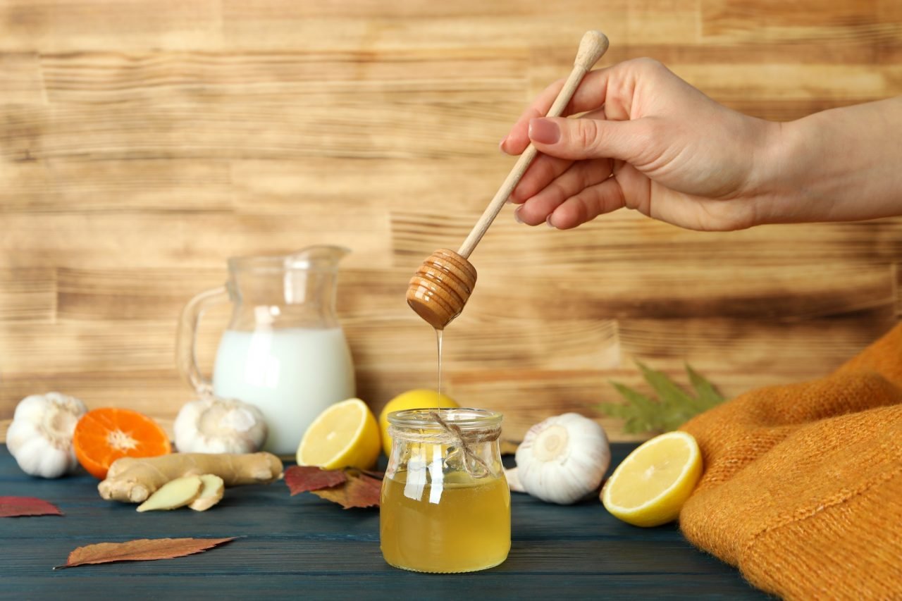 concept-of-treatment-colds-with-honey-and-garlic-on-wooden-table.jpg